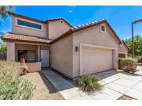 Charming two-story home with desert landscaping, red tile roof and attached two car garage at 10225 W Camelback Rd # 3, Phoenix, AZ 85037