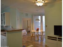 Open-concept dining room featuring a modern ceiling fan and table adjacent to the kitchen at 1701 E Colter St # 280, Phoenix, AZ 85016