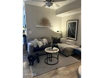 Cozy living room featuring a plush sectional sofa, round coffee table and decorative elements at 1701 E Colter St # 280, Phoenix, AZ 85016