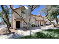 Charming townhome showcasing a two-story facade, complemented by mature trees and well-maintained landscaping at 1961 N Hartford St # 1162, Chandler, AZ 85225