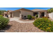 Charming single-story home featuring desert landscaping and a two-car garage at 4262 E Sundance Ave, Gilbert, AZ 85297