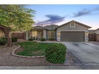 Charming single-story home with a well-manicured lawn, desert landscaping, and a two-car garage at 1508 S Danyell Pl, Chandler, AZ 85286