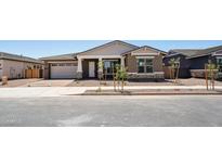Charming single-story home showcasing a two-car garage, neutral stucco, and manicured landscaping at 22825 E Alyssa Rd, Queen Creek, AZ 85142