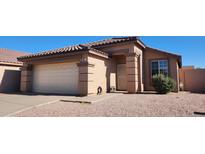 Charming single-story home with a well-maintained front yard and a two-car garage at 2397 E Winchester Pl, Chandler, AZ 85286