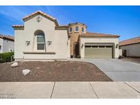Charming single-Gathering home featuring desert landscaping, two-car garage, and barrel tile roof at 514 E Pearce Rd, Phoenix, AZ 85042