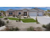Stunning home boasts desert landscaping, a three-car garage, and a charming facade at 6514 W Apex Ave, Queen Creek, AZ 85144