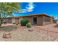 Charming single-story home with desert landscaping, rock ground cover, and a beautiful blue sky at 13821 N Thunderbird Blvd, Sun City, AZ 85351