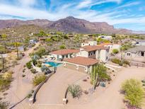 Charming home with a spacious driveway and desert landscaping with a great view of mountains at 3723 S Pottery Rd, Gold Canyon, AZ 85118