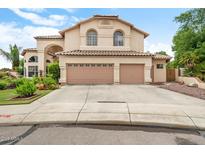 Charming two-story home featuring a two-car garage, tile roof, and desert landscaping at 5839 W Ironwood Dr, Glendale, AZ 85302