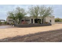 Charming home with desert landscaping and unique architectural design at 2427 W Desert Hills Estate Dr, Phoenix, AZ 85086