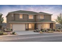 Two-story home featuring a spacious two-car garage and desert landscaping at 26023 S 224Th Pl, Queen Creek, AZ 85142