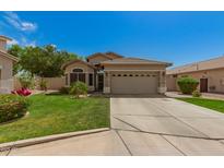Charming single-Gathering home with a two-car garage and well-manicured lawn at 3239 S Tatum Ln, Gilbert, AZ 85297