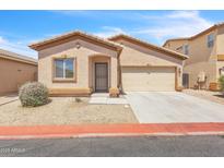 Charming single-story home with desert landscaping and a two car garage at 900 W Broadway Ave # 45, Apache Junction, AZ 85120