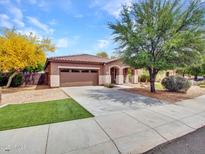 Charming single-story home features a well-manicured front yard and a two-car garage at 15216 W Westview Dr, Goodyear, AZ 85395