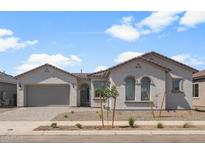 Charming single-story home with a two car garage, desert landscaping, and a tile roof at 22528 E San Tan Blvd, Queen Creek, AZ 85142