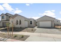 Charming single-story stucco home with a two-car garage and tiled roof at 26160 S 225Th Way, Queen Creek, AZ 85142