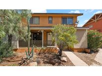 Charming two-story home featuring a welcoming porch and desert-friendly landscaping at 6448 E Paso Nuevo Dr # 101, Cave Creek, AZ 85331