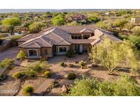 Stunning home featuring desert landscaping, red tile roof, and stucco facade at 8392 E Eagle Feather Rd, Scottsdale, AZ 85266