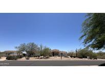 A sprawling single-story house with desert landscaping and a red tile roof at 9267 E Rimrock Dr, Scottsdale, AZ 85255