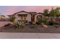 Charming home featuring desert landscaping, stone accents, and a warm, inviting exterior at 9369 W Via Montoya Dr, Peoria, AZ 85383