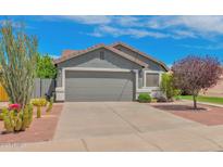 Charming single story home with well-manicured xeriscaped front yard and a large two-car garage at 3284 E Sandy Way, Gilbert, AZ 85297