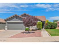 Charming single story home with well-manicured front yard and a large two-car garage at 3284 E Sandy Way, Gilbert, AZ 85297