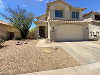 Two story home featuring a two car garage and neutral colors at 25038 N 40Th Ave, Phoenix, AZ 85083