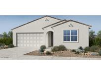 Charming single-story home showcasing a well-manicured front yard and a convenient two-car garage at 25177 N 167Th Ave, Surprise, AZ 85387