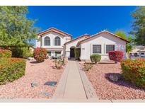 Charming single-Gathering home with a well-manicured front yard and desert landscaping at 2630 E Dolphin Ave, Mesa, AZ 85204