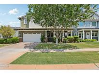 Charming home with a well-manicured lawn, two-car garage, and attractive landscaping at 2942 E Appaloosa Rd, Gilbert, AZ 85296