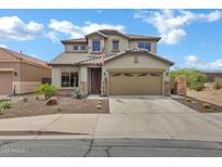 Charming two-story home featuring a tile roof, desert landscaping, and a two car garage at 3033 W Redwood Ln, Phoenix, AZ 85045
