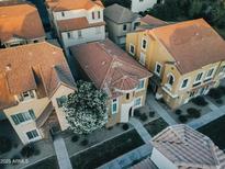 An aerial view of clustered houses with red roofs surrounded by sidewalks and green trees at 4313 E Jasper Dr, Gilbert, AZ 85296
