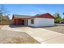 Charming single-story home with a brick accent wall and a spacious driveway at 5371 S Country Club Way, Tempe, AZ 85283