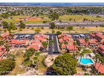 Expansive aerial view showcasing the community's layout and surrounding amenities with sports fields at 7911 E San Miguel Ave # 3, Scottsdale, AZ 85250