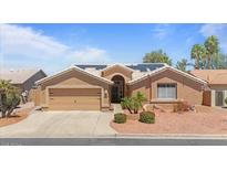 Charming single-story home with well-maintained landscaping, neutral tones, and solar panels at 15774 W Indianola Dr # Six, Goodyear, AZ 85395