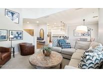 Bright living room with neutral tones, cozy seating, and stylish decor creating a welcoming space at 19475 N Grayhawk Dr # 1128, Scottsdale, AZ 85255