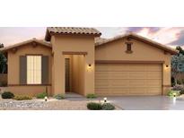 Charming single-story home boasts a neutral color palette, tile roof, and a well-manicured, low maintenance desert-style front yard at 2158 S 242Nd Ln, Buckeye, AZ 85326