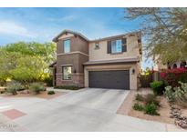 Charming two-story home showcasing a well-kept yard and an attached two-car garage at 21602 N 36Th St, Phoenix, AZ 85050