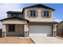 Two-story home featuring a neutral stucco exterior, two-car garage, and decorative shutters at 22368 W Monona Ln, Surprise, AZ 85387