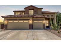 Inviting two-story home featuring a spacious three-car garage and drought-resistant landscaping at 2257 E Redwood Ct, Chandler, AZ 85286