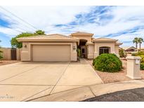 Charming single-story home with a spacious two-car garage, desert landscaping, and a neutral-toned stucco exterior at 2926 N 149Th Dr, Goodyear, AZ 85395