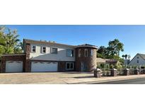 Elegant two-story home with a unique turret feature and a spacious two car garage at 333 W Bethany Home Rd, Phoenix, AZ 85013