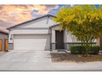 Charming single-story home with a two-car garage, desert landscaping, and inviting front entrance at 5726 W Atlantis Way, Phoenix, AZ 85043