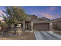 Inviting single-story home featuring a desert landscaped front yard and a convenient two-car garage at 9303 W Oregon Ave, Glendale, AZ 85305