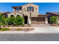 Charming two-story home with a desert landscape, two-car garage and tasteful architectural details at 9548 E Rainbow Ave, Mesa, AZ 85212