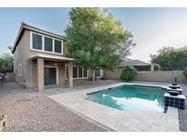 Inviting backyard featuring a refreshing pool, perfect for relaxing and entertaining outdoors at 15028 W Columbine Dr, Surprise, AZ 85379