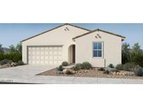 Charming single-story home with neutral stucco, a two-car garage, and a well-manicured desert landscape at 16683 W Hackamore Dr, Surprise, AZ 85387