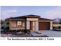 Charming single-story home with a brick facade, desert landscaping, and a two-car garage at 20615 N 226Th Dr, Surprise, AZ 85387
