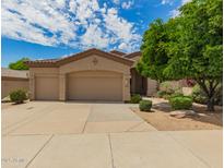 Charming single-Gathering home featuring a three-car garage and well-maintained landscaping at 22322 N 77Th St, Scottsdale, AZ 85255