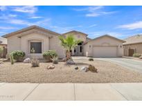 Charming single-story home with desert landscaping and a spacious two-car garage in a quiet neighborhood at 43271 W Little Dr, Maricopa, AZ 85138